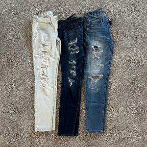 American Eagle Outfitters Cream, Black, and Blue Skinny Jeans